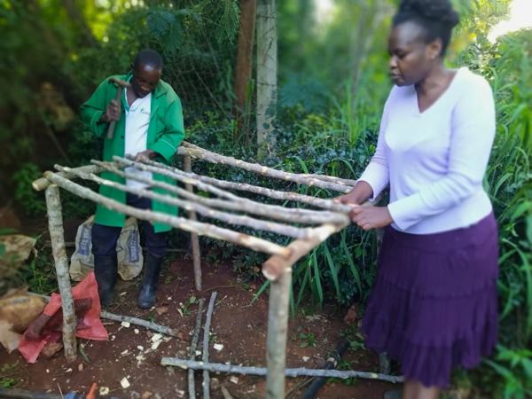Building a rack for displaying and selling harvested vegetables.
